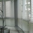 Vinyl-Horizontal-Blinds-At-Curve-Bay-Window